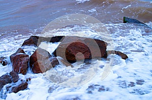 coastal stones in the surf