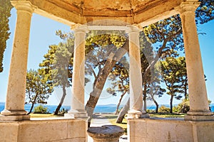 Coastal summer cityscape - view of the sea view from the gazebo with stone columns