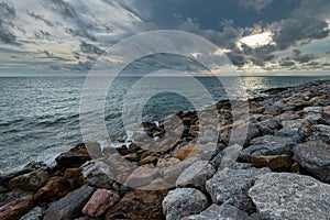 Coastal Sunset, Rocky Coastline with texture of cloudy sky