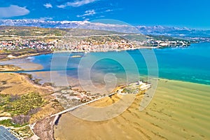 Coastal town of Posedarje and small island church aerial view