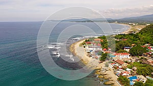 Coastal town with a surfer beach. San Juan, La Union, Philippines.