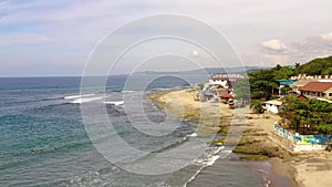 Coastal town with a surfer beach. San Juan, La Union, Philippines.