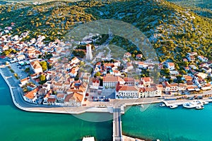 Coastal town of Tisno aerial panoramic view, bridge to island of Murter