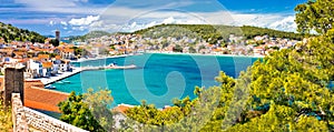 Coastal town of Tisno waterfront panoramic view, bridge to island of Murter