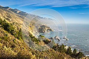 Coastal view of Big Sur landscape and scenery, with pacific ocean and rocks on the coastline during sunset.California, USA