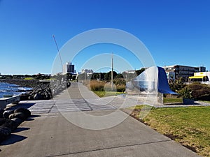 Coastal Walkway in New Plymouth with artwork `Light on the Land` and wind wand