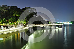 A coastal walkway by night with reflection