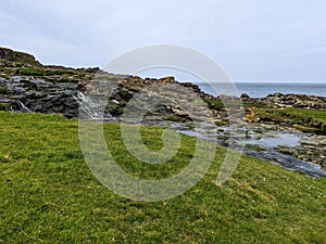 Coastal Waterfall from the Northern Irelands coast at the North Atlantic Sea