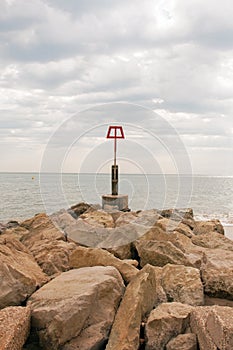 Coastal rocks and scenery along Bournemouth beach in Dorset.