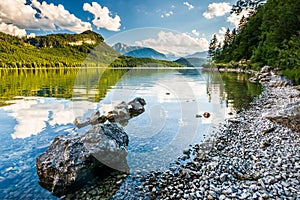 Coastline in Altausseer lake, distant Dachstein