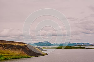 The coastline around the pond Stakholstjorn with pseudo craters - natural monument near Lake Myvatn in Northern Iceland