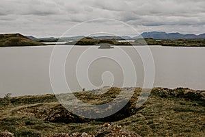 The coastline around the pond Stakholstjorn with pseudo craters - natural monument near Lake Myvatn in Northern Iceland