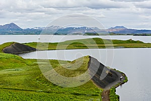 The coastline around the pond Stakholstjorn with pseudo craters - natural monument near Lake Myvatn in Northern Iceland