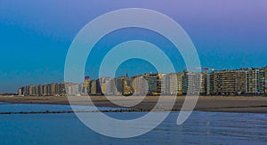 The coastline of Blankenberge, popular Belgian city at the beach, lighted city architecture by night in Belgium