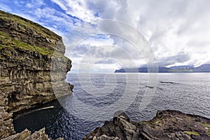 Coastline and cliff near the little village GjÃ³gv, Faroe Island