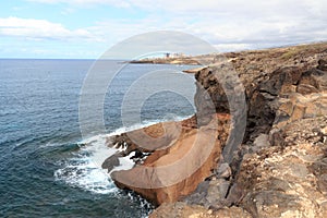 Coastline with cliffs and Atlantic Ocean near beach Playa de los Morteros on Canary Island Tenerife, Spain photo