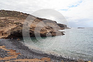 Coastline with cliffs at beach Playa de los Morteros on Canary Island Tenerife, Spain photo