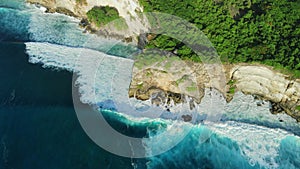 Coastline with cliffs, ocean and waves in Uluwatu, Bali