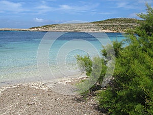 Coastline of Comino, Malta under a blue sky