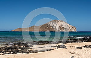 Coastline of East Oahu over Makapuu Beach with Rabbit island