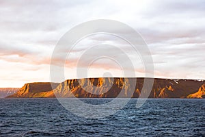 Glowing light on coastline, Iceland