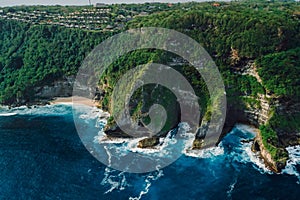 Coastline landscape with rocks and blue ocean with waves. Aerial view