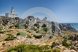 Coastline and lighthouse in Capo Testa, Sardinia, Italy