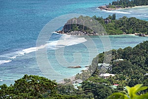 Coastline of MahÃ©, Seychelles with houses and granite rocks