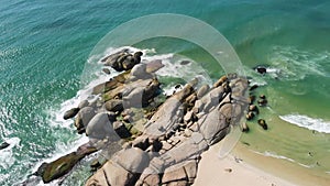 Coastline on Mole beach with rocks and sea waves in Brazil. Aerial view of Praia Mole