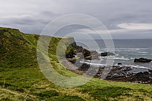 Coastline in northern Ireland with cloudy sky