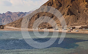 The coastline of the Red Sea and the mountains in the background. Egypt, the Sinai Peninsula. Coral reef Blue Hole