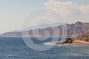 The coastline of the Red Sea and the mountains in the background. Egypt, the Sinai Peninsula. Coral reef Blue Hole