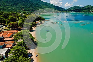 Coastline in Santo Antonio de Lisboa in Brazil with boats in sea. Aerial view photo