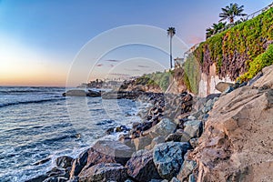 Coastline scenery of ocean and waterfront houses in San Diego CA at sunset
