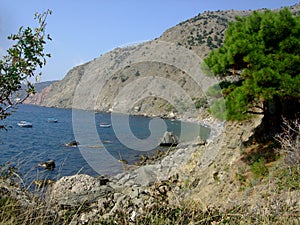 Coastline of sea with hills and stones on the beach. Black sea. Crimea