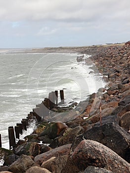 Coastline with Silent Water and breakwater Rocks