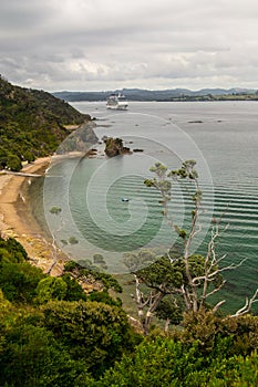 Coastline view from Tapeka Point Track with blue sky above in Russell, Northland, New Zealand