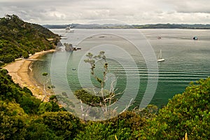 Coastline view from Tapeka Point Track with blue sky above in Russell, Northland, New Zealand