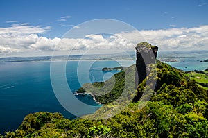 Coastline view from the top of Te Whara Track with blue sky above in Whangarei Heads, Northland, New Zealand