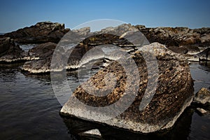 Unikalne kamienie w wodzie, Gudhjem, Bornholm photo