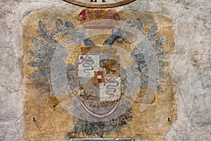 Coat of arms on Bergamo clock tower. Upper town of Bergamo, Italy