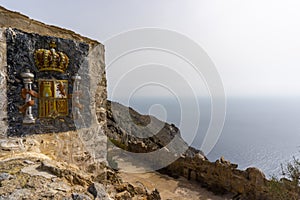 Coat of arms emblem on the fortress wall at the Bateria de Castillitos in Murcia