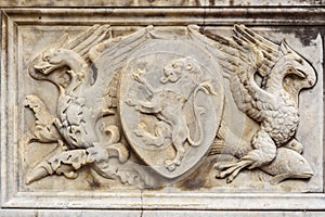 Coat of arms etail of Fonte Gaia is monumental fountain in Piazza del Campo in Siena. Italy