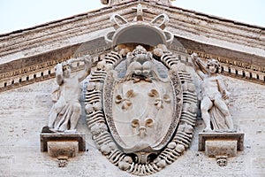 Coat-of-arms of France on the facade of Church of St Louis of the French, Rome