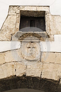 Coat of arms made of carved stone in the old town of Alarcon