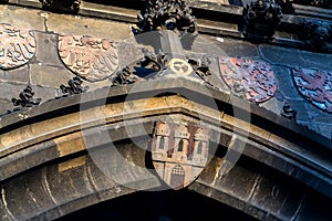 Coat of arms on the Old Town Bridge Tower guarding end of the Charles Bridge and entrance to Old Town of Prague