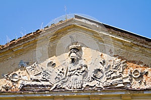 Coat of arms of Polish count Potocki family Silver Pilawa in Tulchyn on left wing of palace, summer day, clear deep blue sky