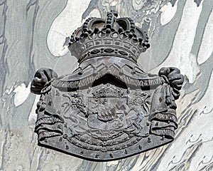 Coat of arms relief on a wall in Vienna, Austria.