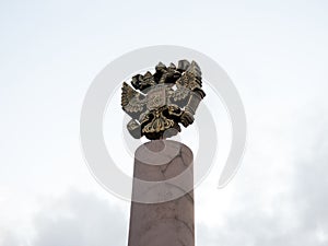 Coat of arms of Russia is the official state symbol of the Russian Federation cast in bronze on the top of the pillar.