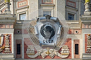 The Coat of Arms of the Soviet Union on the main building of Moscow state University. Moscow, Russia.